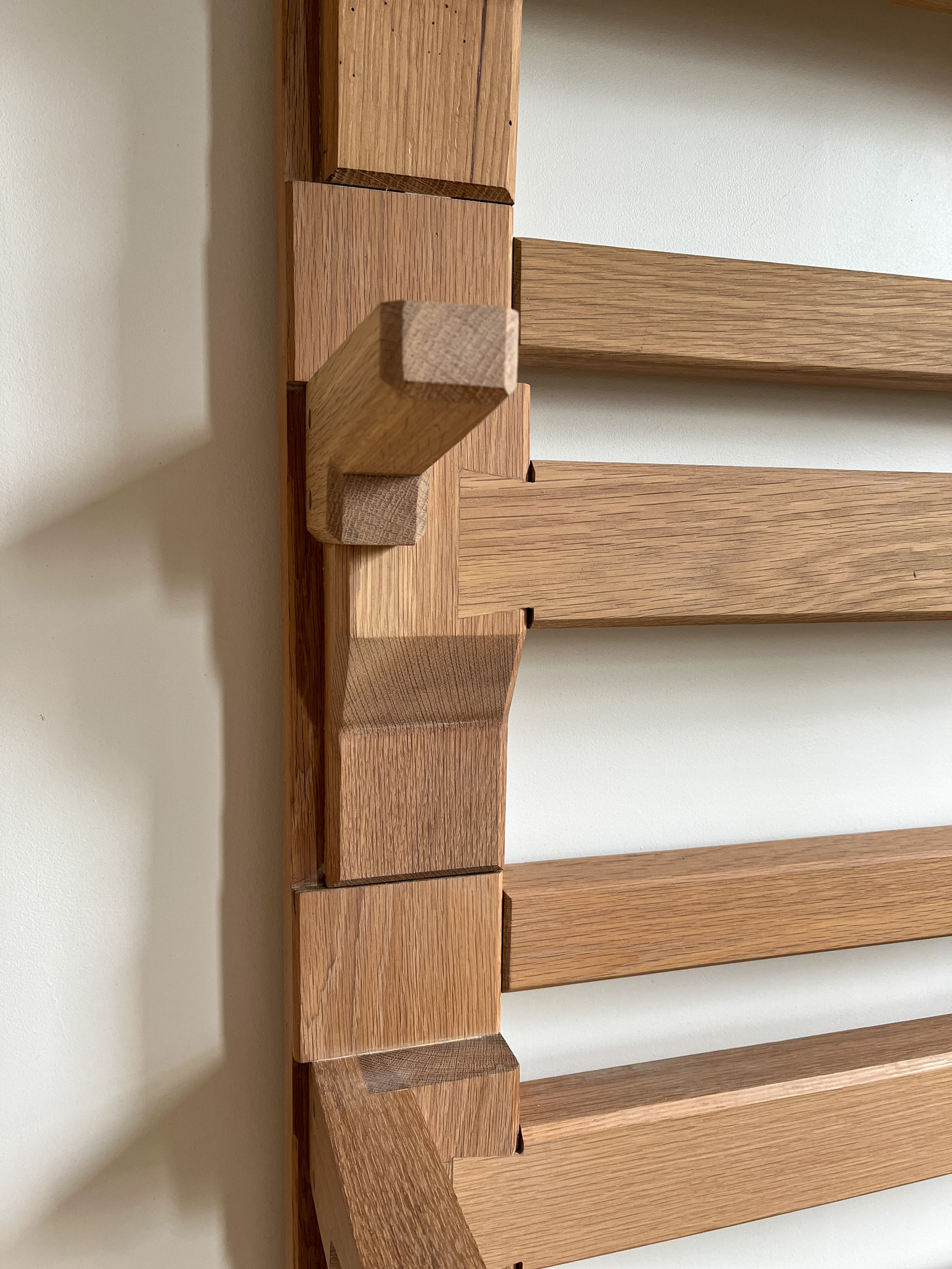 Chamfered fishtail joints, traditional joinery. Close-up of brackets. 