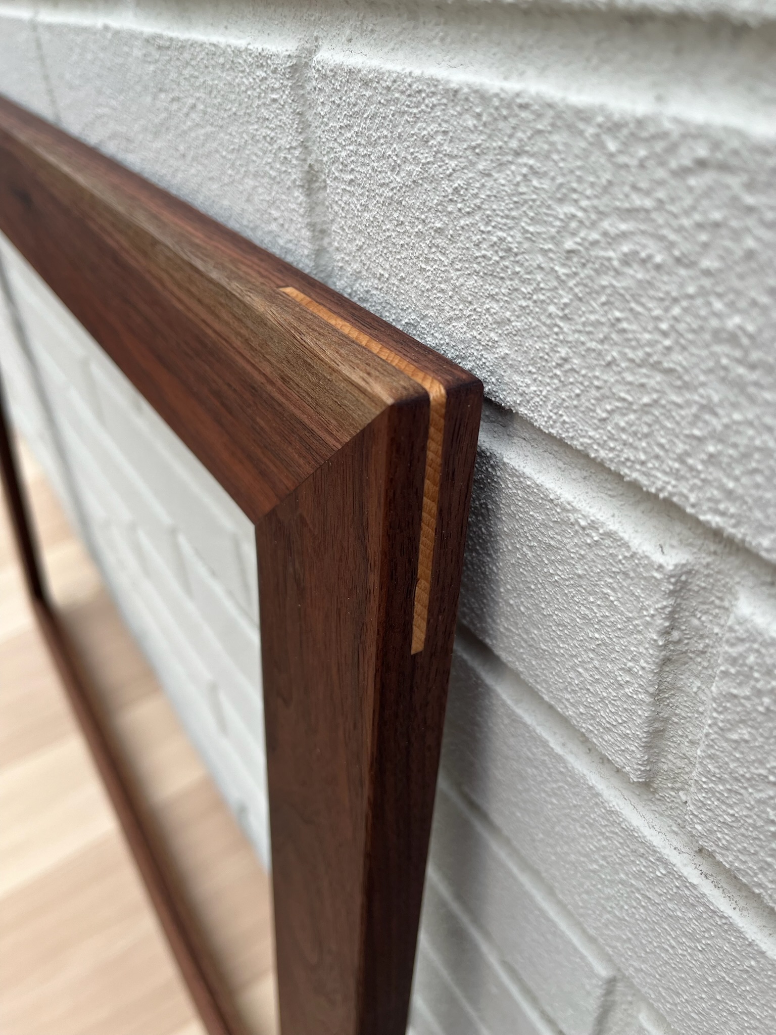 Walnut frame with cherry wood splines. Corner view.