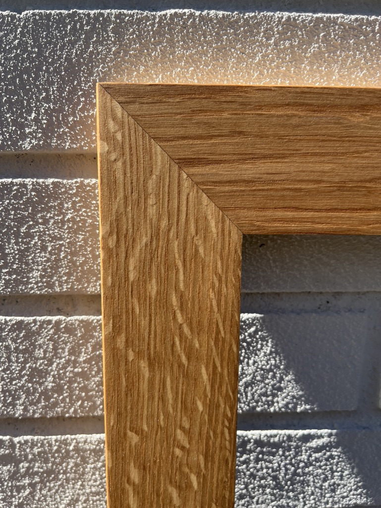 White oak frame. Medullary rays on side rail. Corner view.