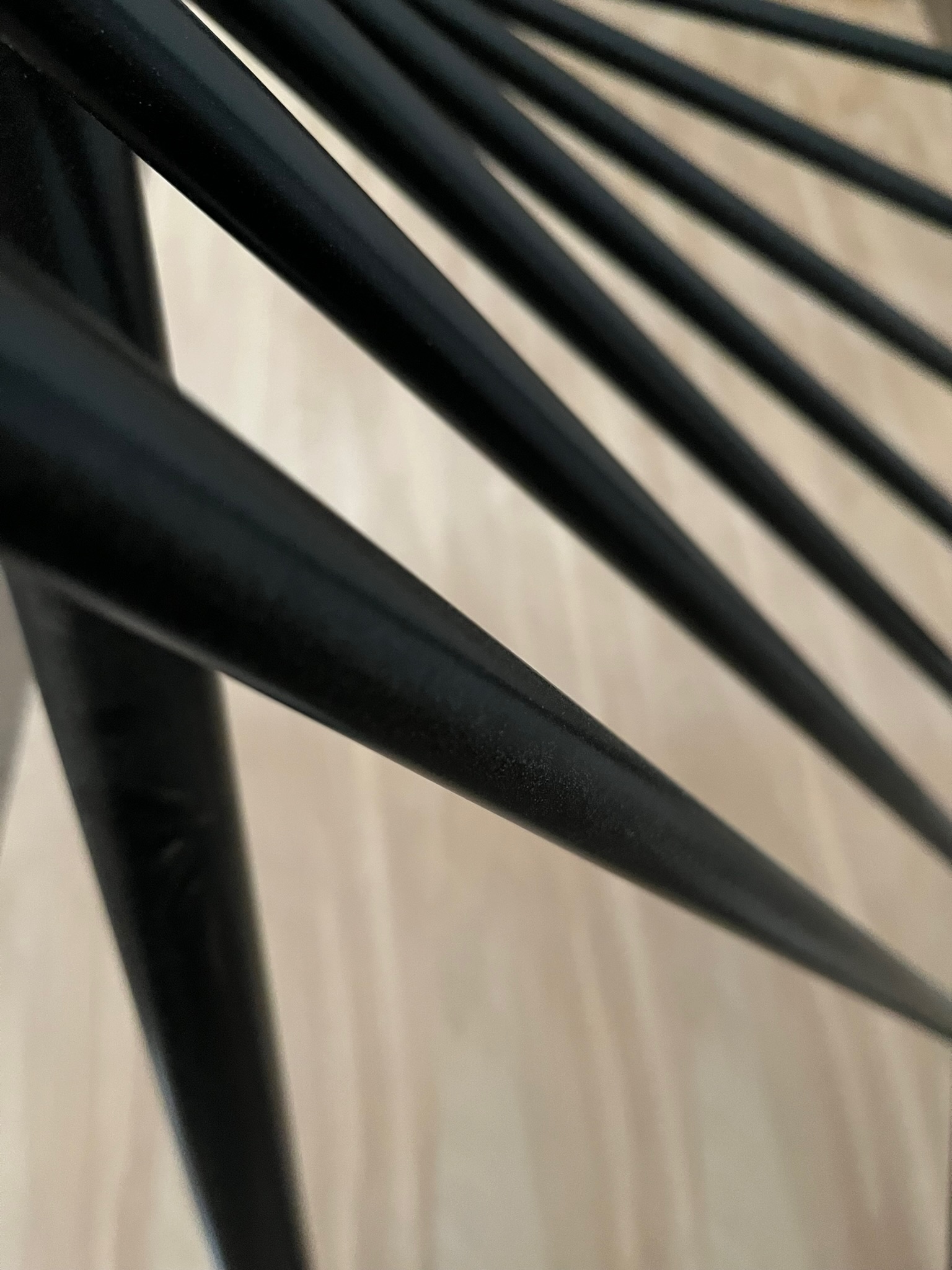 steel table base, close up, resembling spokes.