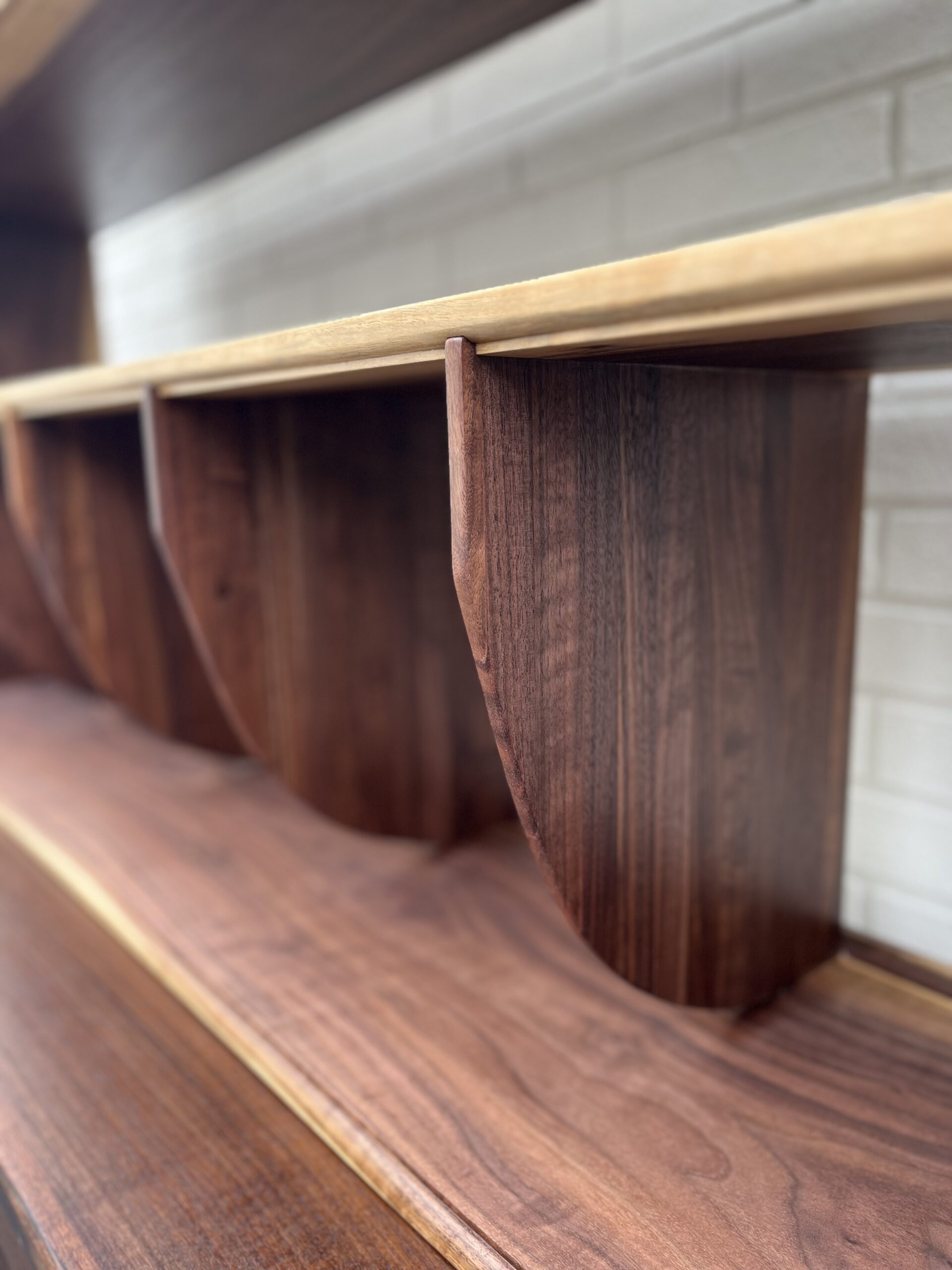 the first shelf, a vinyl record shelf with dividers every foot, on a larger shelving unit.